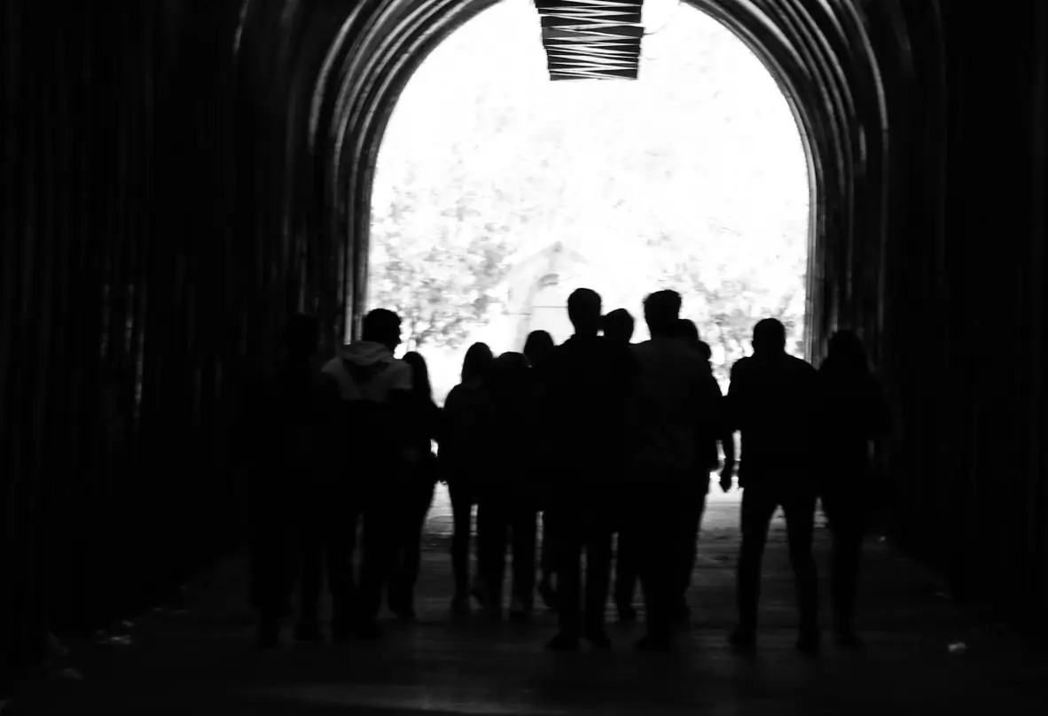 group of like minded people walking down the tunel